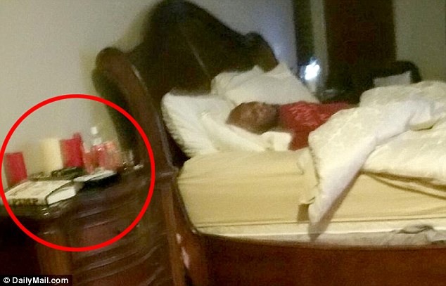 Accessories: On the bedside table, circled, are what appear to be a copy of Pimp, the autobiography of the brothel